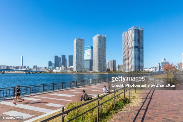 tokyo skyline waterfront view in toyosu area, koto ward, japan at day time. - toyosu stock pictures, royalty-free photos & images