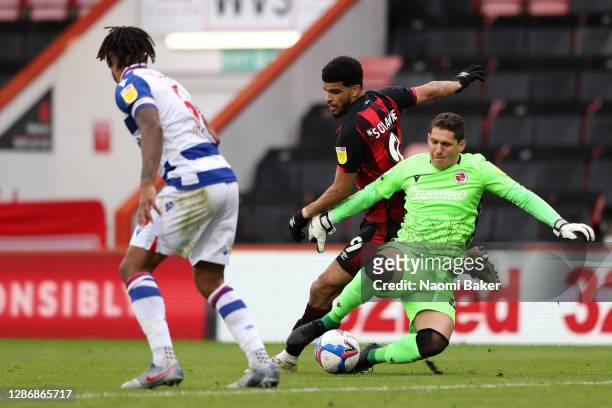 Rafael Cabral Barbosa of Reading is challenged by Dominic Solanke of AFC Bournemouth, as Dominic Solanke of AFC Bournemouth then goes on to score his...