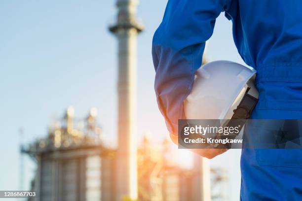 engineering and technology with oil refinery industry plant - oil and gas workers imagens e fotografias de stock