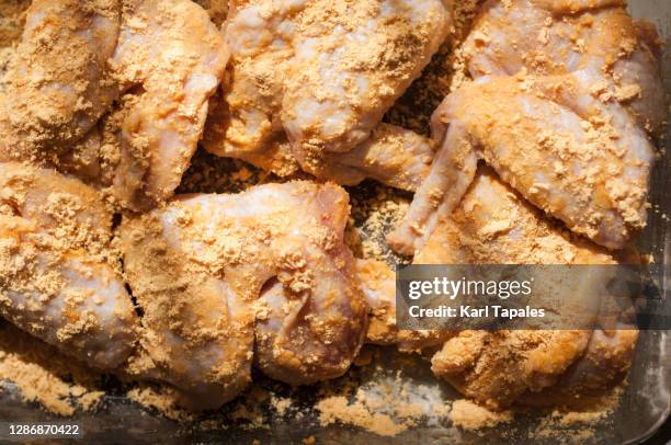raw chicken wings marinated with powdered salted egg - marinated stock pictures, royalty-free photos & images