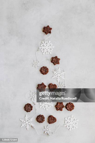 traditional christmas cookies baked in switzerland and called in german language brunsli. - natalia star stock pictures, royalty-free photos & images