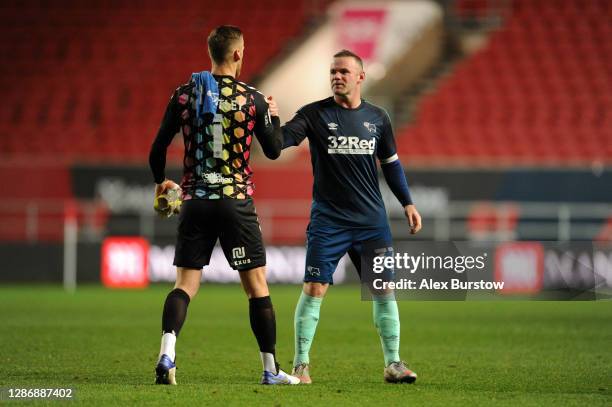 Wayne Rooney of Derby County shakes hands with Daniel Bentley of Bristol City following the Sky Bet Championship match between Bristol City and Derby...