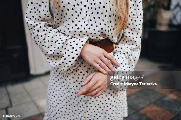 beautiful female hands with well-groomed manicure. - polka dot fashion stock pictures, royalty-free photos & images