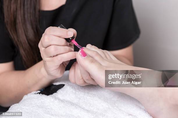 woman getting nails done closeup - nail salon stock pictures, royalty-free photos & images