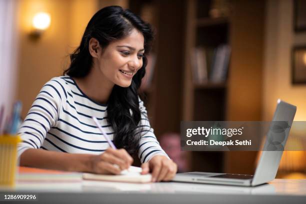 young man studying - stock photo - india woman computer stock pictures, royalty-free photos & images