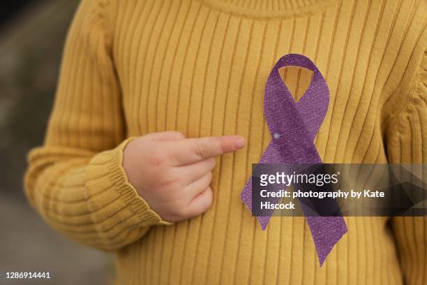 purple awareness ribbon - mental illness awareness stock pictures, royalty-free photos & images