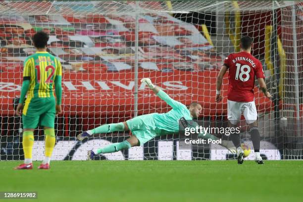 Sam Johnstone of West Bromwich Albion saves a penalty from Bruno Fernandes of Manchester United, which following a VAR is retaken, as Sam Johnstone...