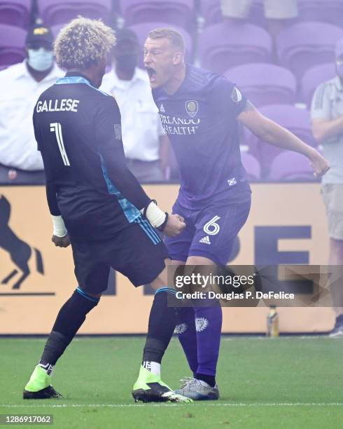 Pedro Gallese and Robin Jansson of Orlando City SC reacts after defeating New York City FC during penalty kicks of Round One of the MLS Cup Playoffs...