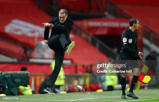 Slaven Bilic, Manager of West Bromwich Albion kicks a drinks can as he reacts during the Premier League match between Manchester United and West...