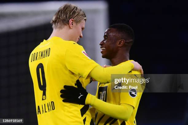 Erling Haaland and Youssoufa Moukoko of Dortmund chat after the Bundesliga match between Hertha BSC and Borussia Dortmund at Olympiastadion on...