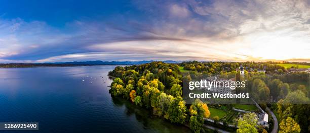 germany, bavaria, bernried am starnberger see, drone panorama of lake starnberg and bernried abbey at summer sunset - starnberger see stock-fotos und bilder