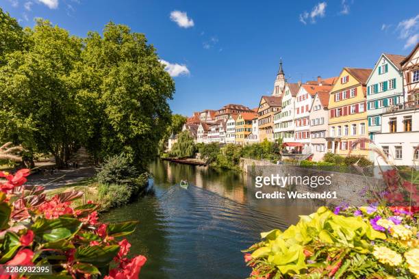 germany, baden-wurttemberg, tubingen, neckar river canal with row of townhouses in background - tübingen stock pictures, royalty-free photos & images