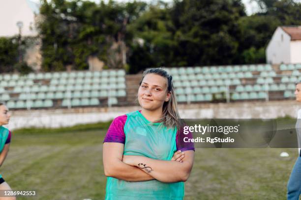 portrait of a happy female rugby player - youth club stock pictures, royalty-free photos & images