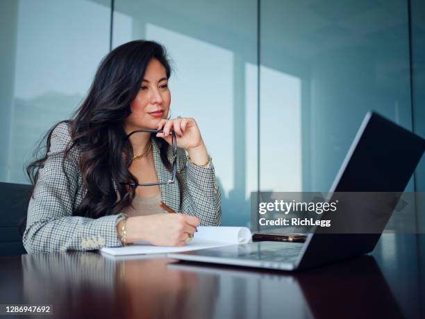 woman at work in a law office - lawyer office stock pictures, royalty-free photos & images