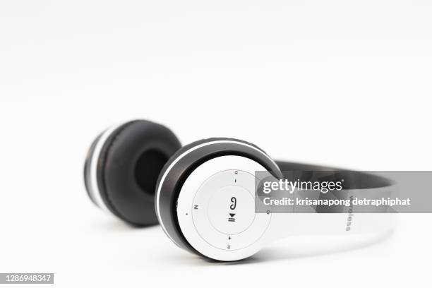 white headphones - headphones isolated stock pictures, royalty-free photos & images