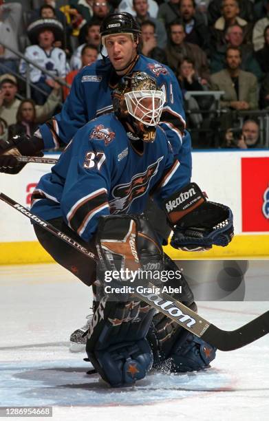 Olaf Kolzig of the Washington Capitals skates against the Toronto Maple Leafs during NHL game action on January 22, 2000 at Air Canada Centre in...