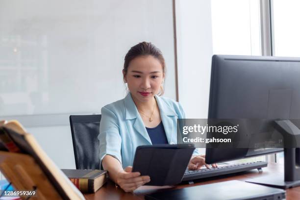 young female entrepreneur working with technology - lawyer computer stock pictures, royalty-free photos & images