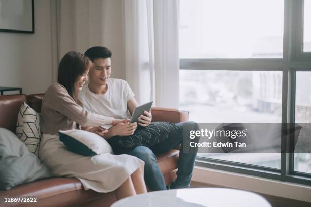 Premium Photo  Relaxed asian couple chilling together at home