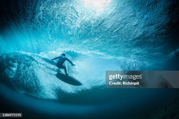 surfer falling - surfer wave stock pictures, royalty-free photos & images