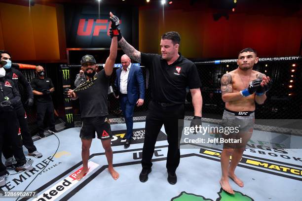 Deiveson Figueiredo of Brazil celebrates his submission victory over Alex Perez in their flyweight championship bout during the UFC 255 event at UFC...