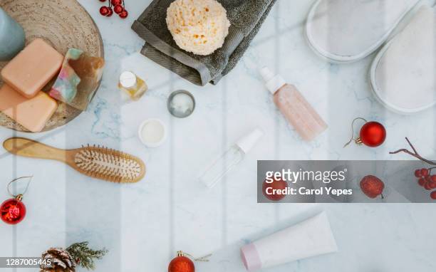 organic spa cosmetic on marble  background with christmas ornaments - yule marble stock pictures, royalty-free photos & images