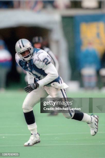 Deion Sanders of the Dallas Cowboys in position during a football game against the Philadelphia Eagles on December 10, 1995 at Veterans Stadium in...