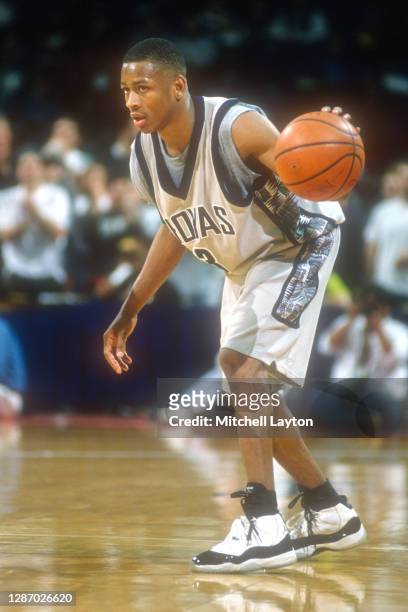 Allen Iverson of the Georgetown Hoyas dribbles the ball during a college basketball game against the Connecticut Huskies at USAir Arena on February...