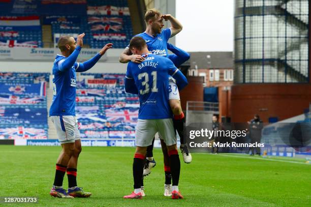 Scott Arfield of Rangers celebrates with Borna Barisic of Rangers after scoring their sides third goal during the Ladbrokes Scottish Premiership...