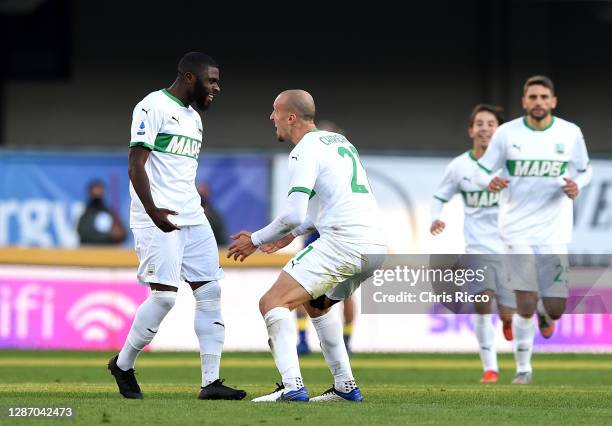 Jeremie Boga of US Sassuolo celebrates after scoring their sides first goal with Vlad Chiriches of US Sassuolo during the Serie A match between...