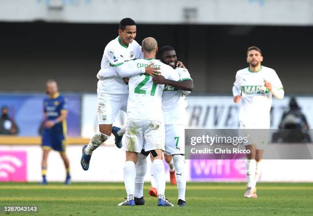 Jeremie Boga of US Sassuolo celebrates after scoring their sides first goal with Rogerio of US Sassuolo and Vlad Chiriches of US Sassuolo during the...
