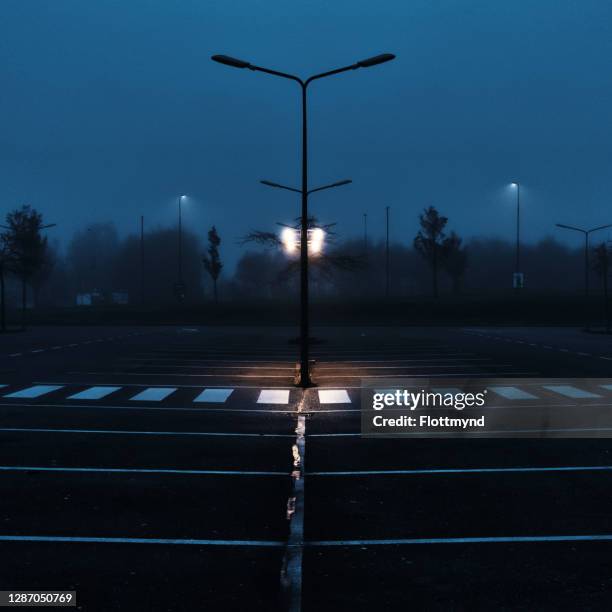 foggy morning on an empty parking lot - dividing line stock pictures, royalty-free photos & images