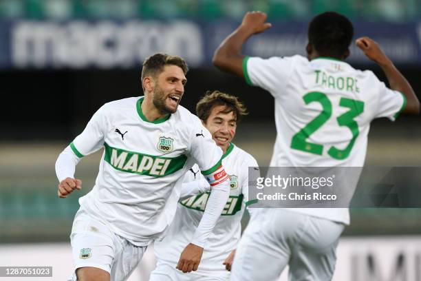 Domenico Berardi of US Sassuolo celebrates after scoring their sides second goal with Maxime Lopez of US Sassuolo and Hamed Junior Traore of US...