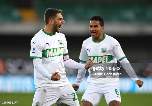 Domenico Berardi of US Sassuolo celebrates after scoring their sides second goal with Rogerio of US Sassuolo during the Serie A match between Hellas...