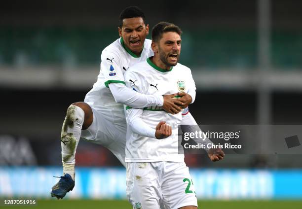 Domenico Berardi of US Sassuolo celebrates after scoring their sides second goal with Rogerio of US Sassuolo during the Serie A match between Hellas...