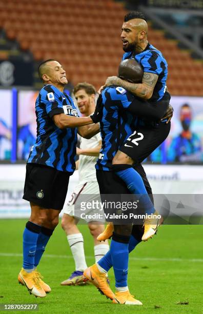 Romelu Lukaku of Inter Milan celebrates after scoring their sides third goal with team mates Arturo Vidal and Alexis Sanchez during the Serie A match...
