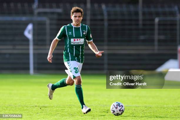 Mirko Boland of VfB Luebeck runs with the ball during the 3. Liga match between VfB Luebeck and Bayern Muenchen II at Stadion an der Lohmuehle on...