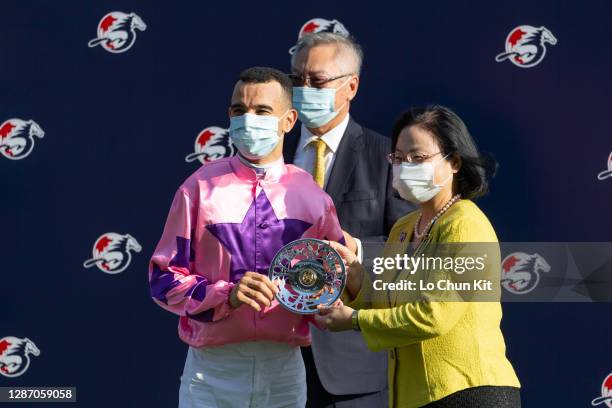 Steward Margaret Leung presents the Jockey Club Sprint silver dish to Hot King Prawn’s jockey Joao Moreira at Sha Tin Racecourse on November 22, 2020...