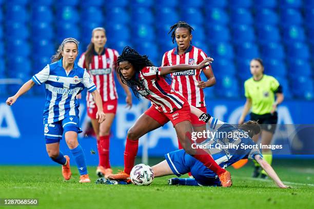 Iris Arnaiz of Deportivo Abanca competes for the ball with Ludmila Da Silva of Atletico de Madrid during the Primera Division Femenina match between...