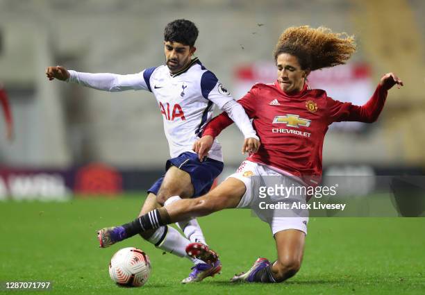 Dilan Markanday of Tottenham Hotspur is tackled by Hannibal Mejbri of Manchester United during the Premier League 2 match between Manchester United...