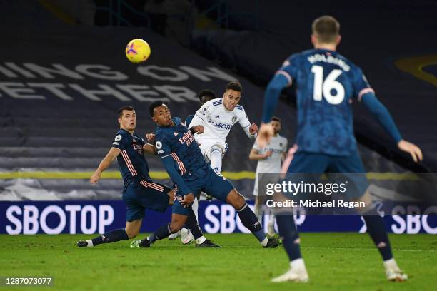 Rodrigo Moreno of Leeds United shoots and hits the cross bar whilst under pressure from Gabriel and Granit Xhaka of Arsenal during the Premier League...
