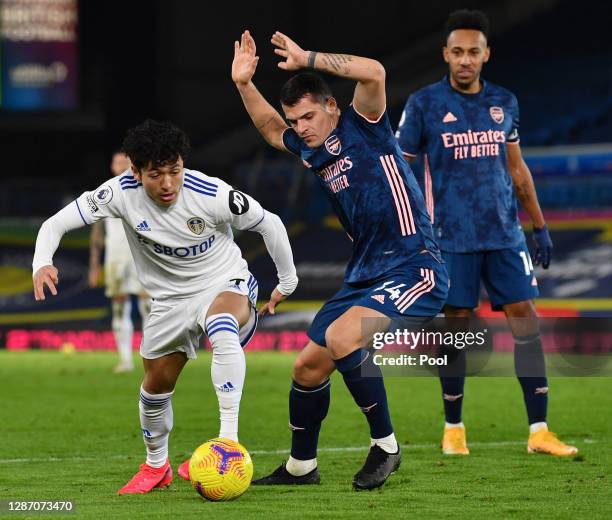 Ian Poveda-Ocampo of Leeds United is challenged by Granit Xhaka of Arsenal during the Premier League match between Leeds United and Arsenal at Elland...