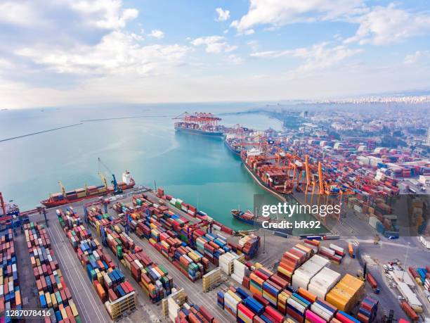 cargo containers in a commercial port. - cargo containers stock pictures, royalty-free photos & images