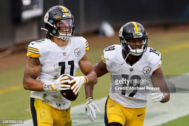 Chase Claypool and JuJu Smith-Schuster of the Pittsburgh Steelers react after Claypool's touchdown during the first half against the Jacksonville...