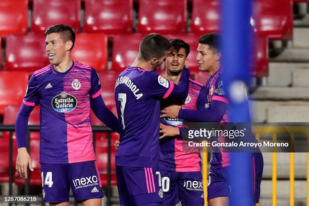 Jota of Real Valladolid celebrates with team mates Ruben Alcaraz , Sergi Guardiola and Marcos Andre after scoring their sides third goal during the...