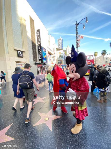 mikkey mouse earning tips on hollywood boulevard, usa - hollywood boulevard stock pictures, royalty-free photos & images