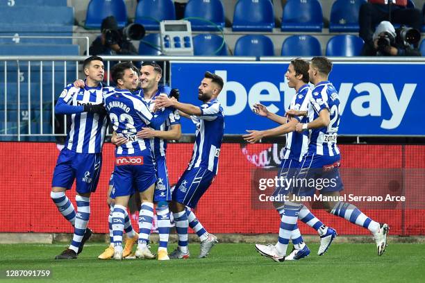 Ximo Navarro of Deportivo Alaves celebrates with teammates after scoring their team's first goal during the LaLiga Santander match between Alaves and...