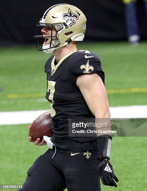 Taysom Hill of the New Orleans Saints celebrates his touchdown run in the third quarter against the Atlanta Falcons at Mercedes-Benz Superdome on...