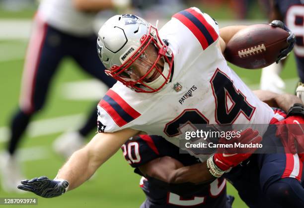 Rex Burkhead of the New England Patriots carries the ball following a reception in the third quarter during their game against the Houston Texans at...