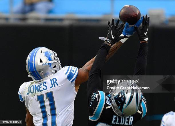 Marvin Jones of the Detroit Lions fails to pull in this fourth down reception as he is defended by Corn Elder of the Carolina Panthers during the...