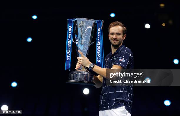 Daniil Medvedev of Russia lifts the trophy after winning his singles final match against Dominic Thiem of Austria during day eight of the Nitto ATP...